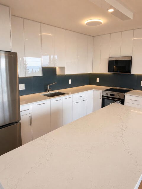 Kitchen detail with teal backsplash