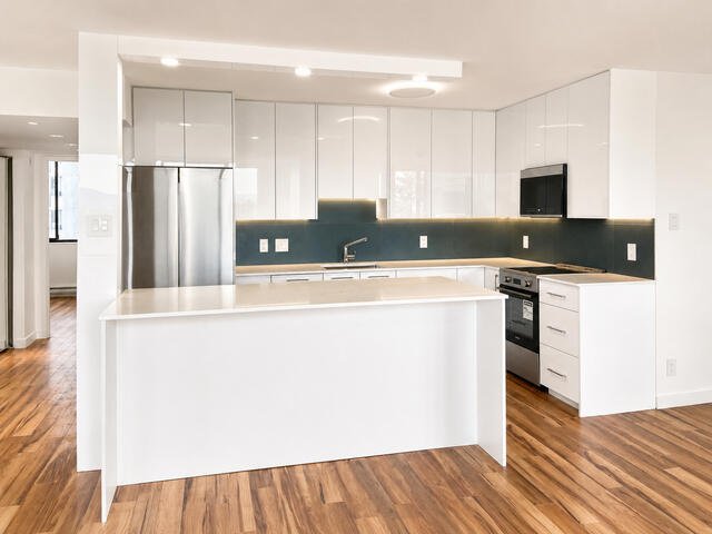 Renovated kitchen with quartz island